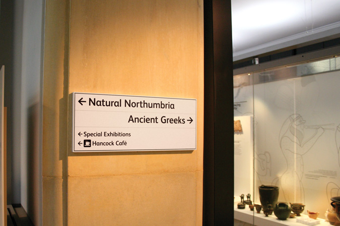 Interior sign in gallery entrance threshold
